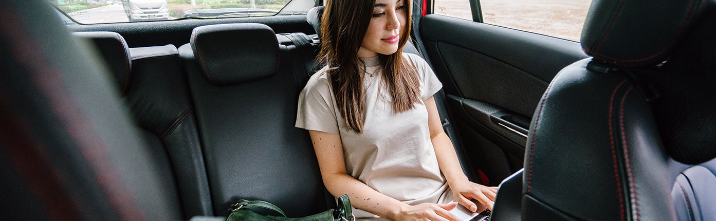 Woman Working in the back of a Car 1 Woman Working in the back of a Car 1